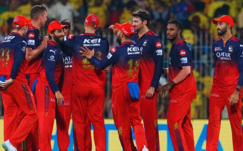 CSK vs RCB: Players in Royal Challengers Bengaluru IPL team jersey.